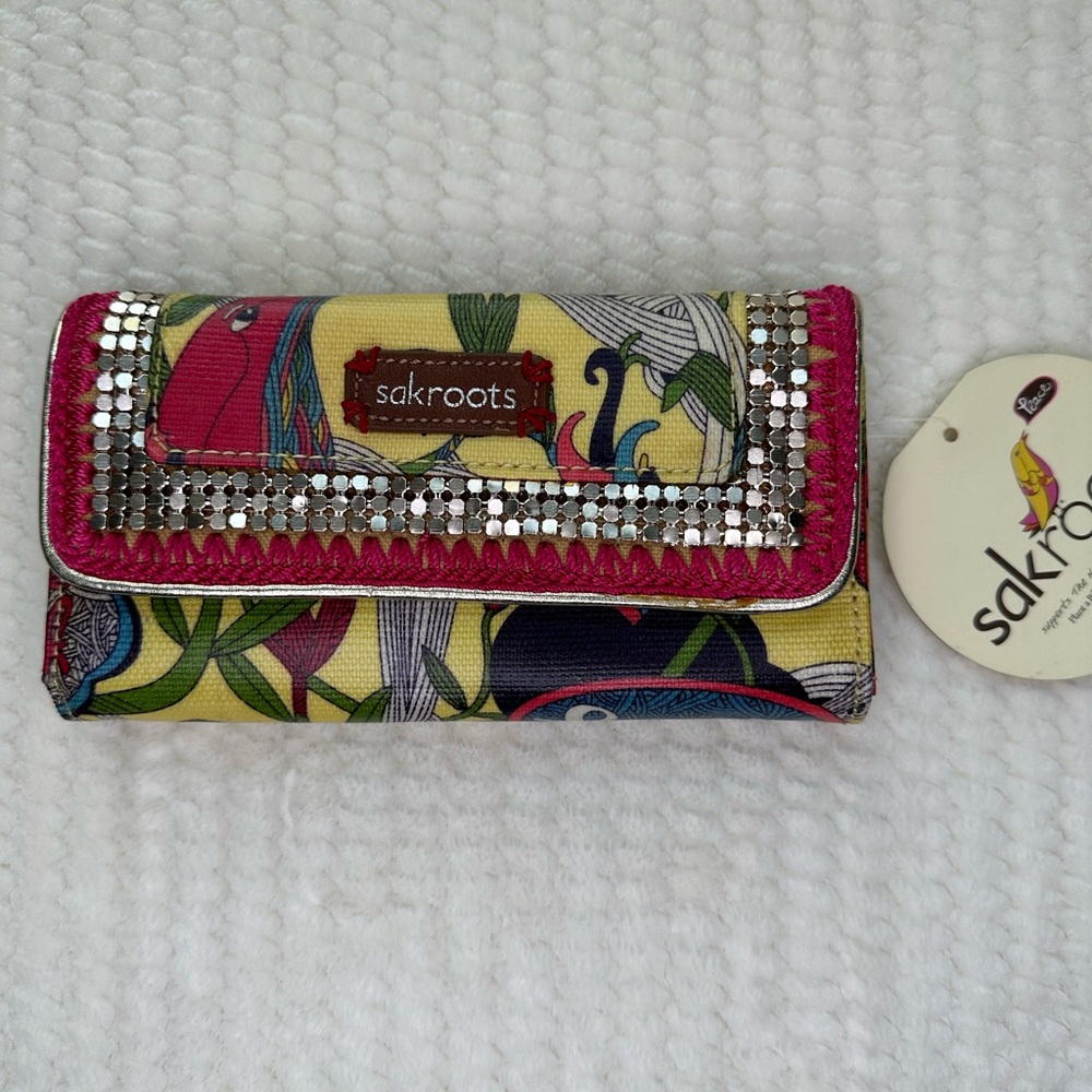 The Sak SakRoots yellow peace birds trifold wallet Sequin and embroidered trim
